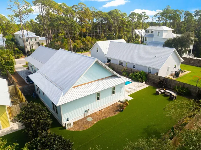 an aerial view of a house with a garden