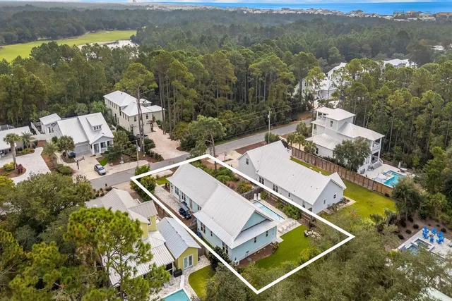 an aerial view of a house with a garden