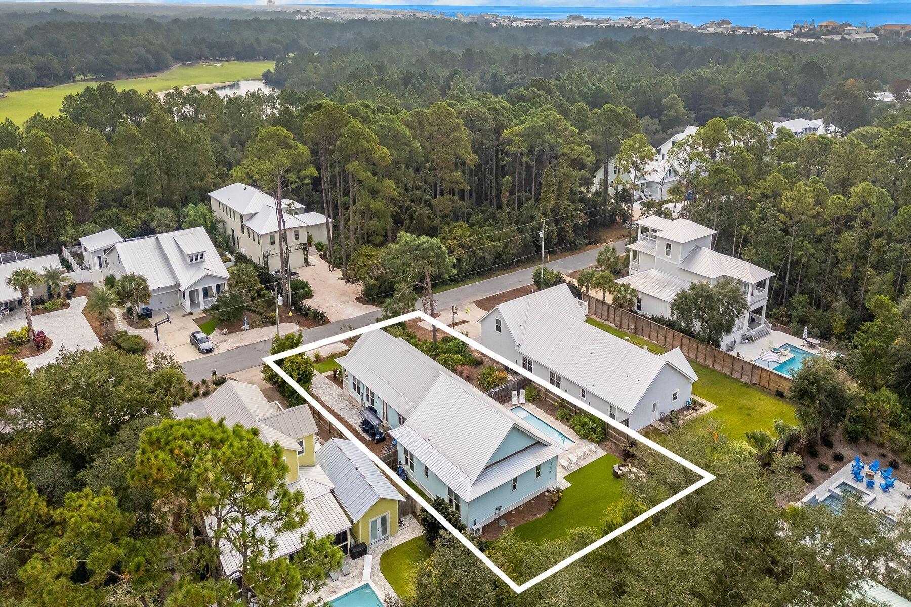 389 Seacrest Drive Seacrest, FL 32461 - Photo 30 of 33 an aerial view of a house with a garden