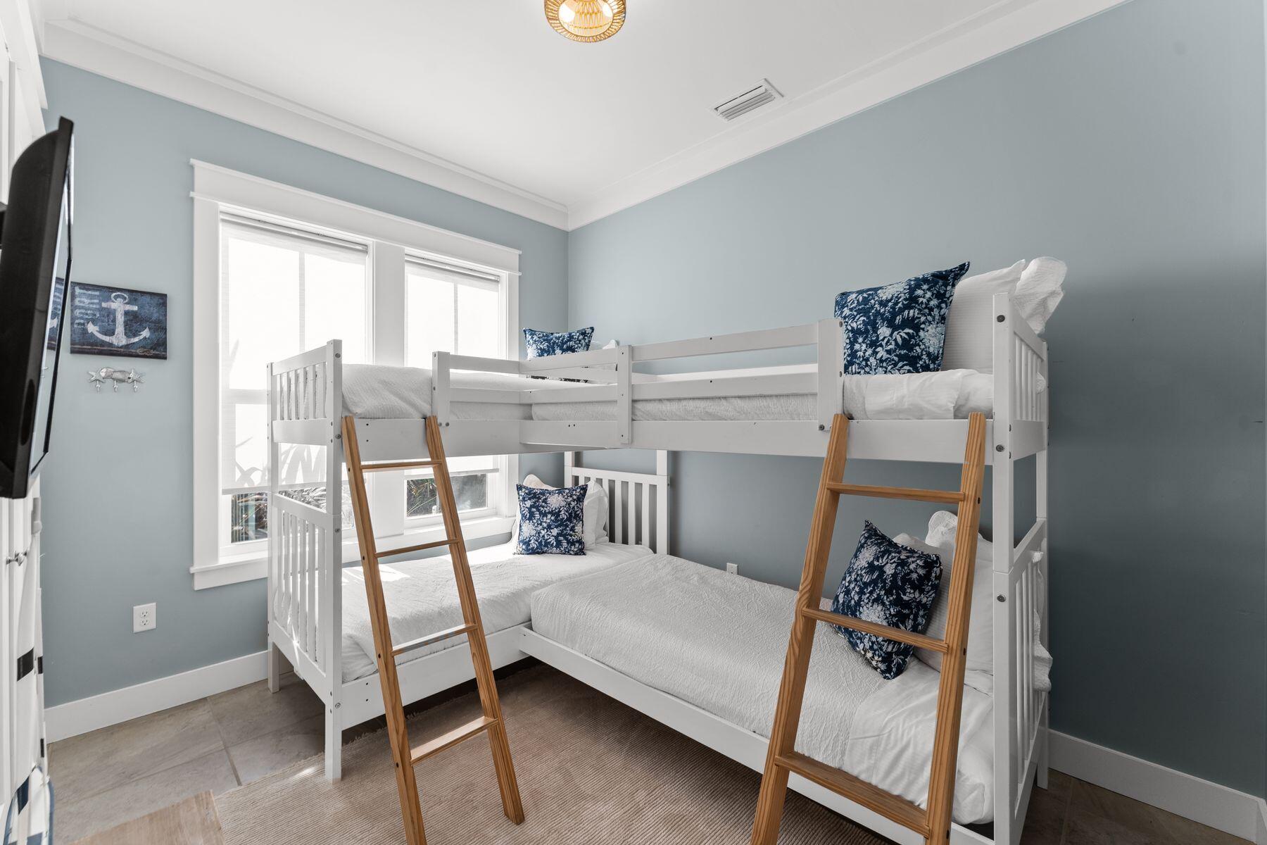 389 Seacrest Drive Seacrest, FL 32461 - Photo 6 of 33 a bedroom with a bed and a window