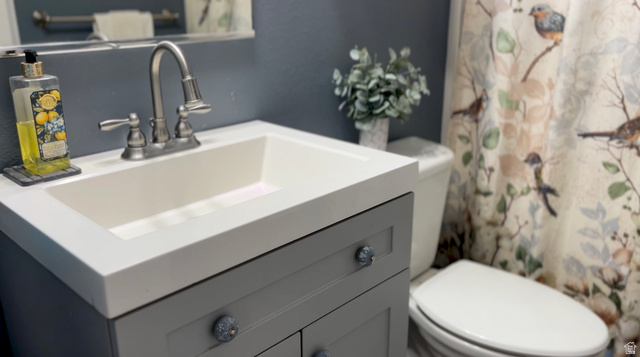 1797 Sunset Road Enoch, UT 84721 - Photo 30 of 80 Integrated vanity with white sink, brushed nickel faucet, and gray cabinetry featuring decorative knobs
