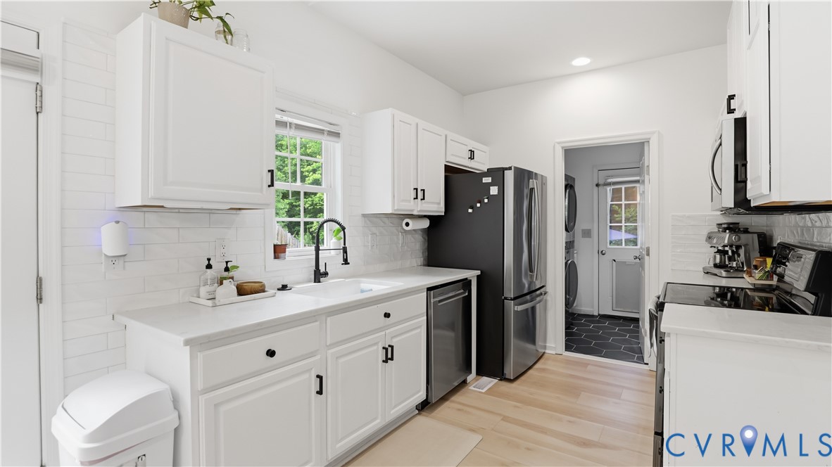 2406 Emanuel Church Road Powhatan, VA 23139 - Photo 12 of 48 Kitchen featuring white cabinetry, light-tone wood