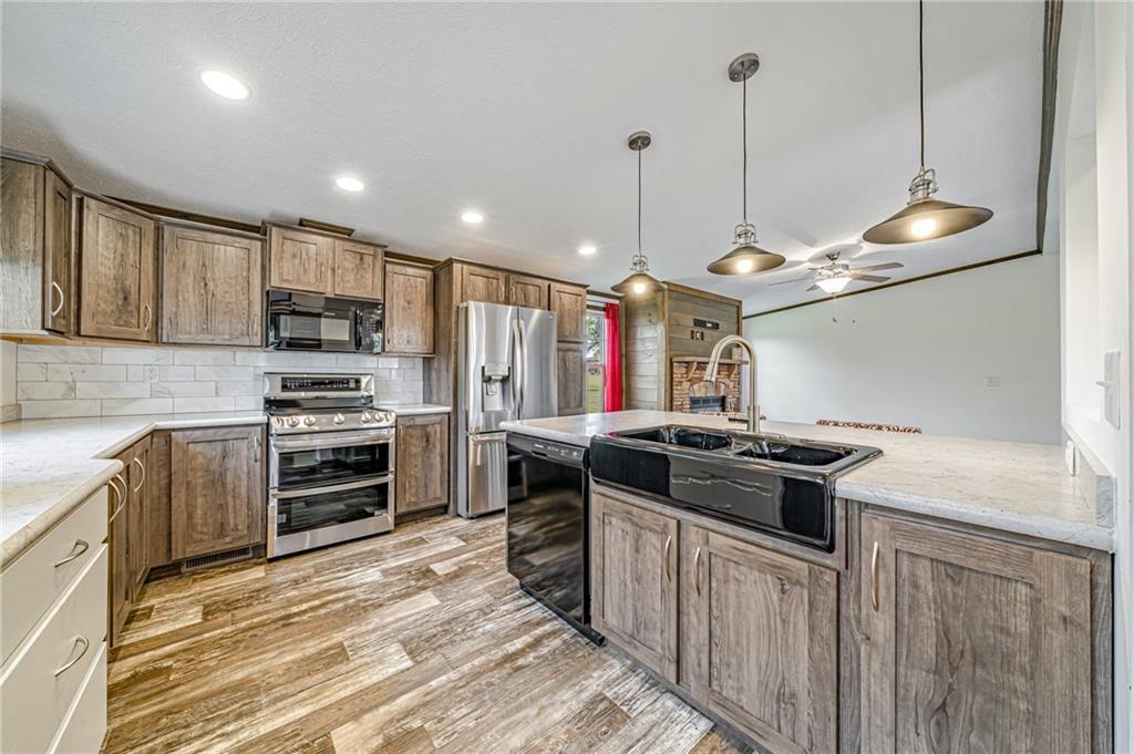 120 Buckeye Road Mount Pleasant, PA 15666 - Photo 8 of 26 Spacious kitchen with new refrigerator and electric stove! Additional appliances