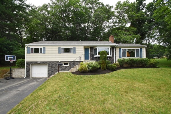 55 Christopher Road Waltham, MA 02451 - Photo 1 of 19 a front view of a house with a yard