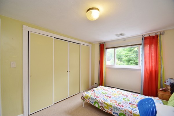 55 Christopher Road Waltham, MA 02451 - Photo 11 of 19 a bedroom with a bed and a window