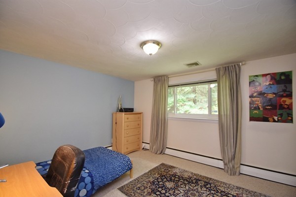 55 Christopher Road Waltham, MA 02451 - Photo 12 of 19 a bedroom with furniture and a window