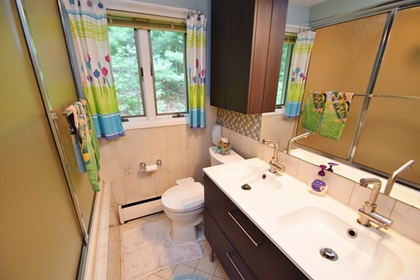 55 Christopher Road Waltham, MA 02451 - Photo 14 of 19 a bathroom with a sink a toilet and a mirror