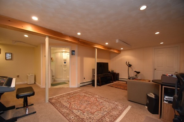 55 Christopher Road Waltham, MA 02451 - Photo 16 of 19 a view of a livingroom with furniture and a flat screen tv