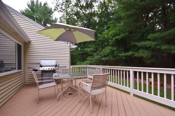 55 Christopher Road Waltham, MA 02451 - Photo 19 of 19 a view of balcony with wooden floor and outdoor seating