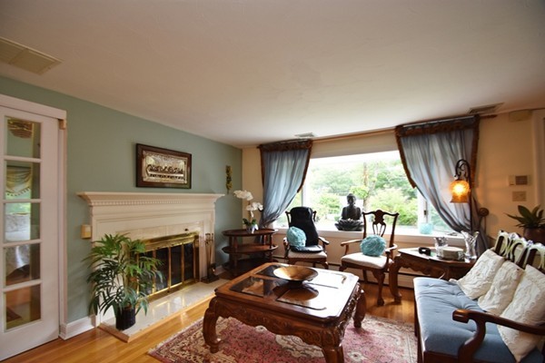 55 Christopher Road Waltham, MA 02451 - Photo 3 of 19 a living room with furniture and a large window