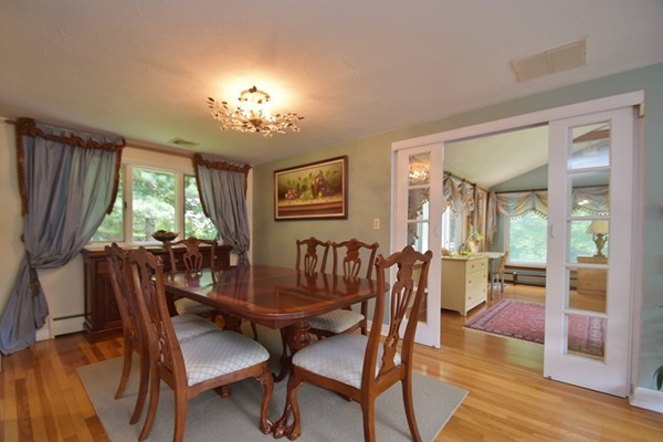 55 Christopher Road Waltham, MA 02451 - Photo 6 of 19 a view of a dining room with furniture window and wooden floor