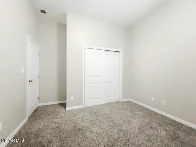 an empty room with closet
