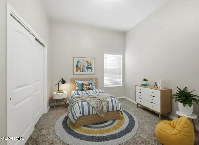 a bedroom with a bed and a couch