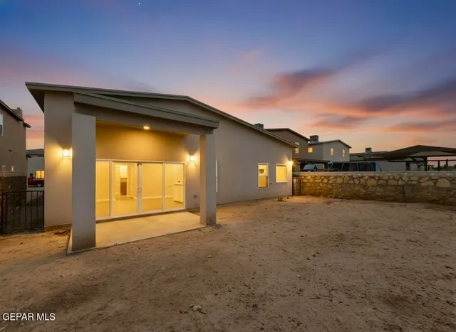 a view of an empty room with a kitchen