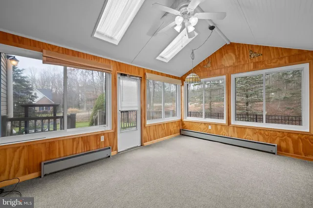 a view of an empty room with a large window
