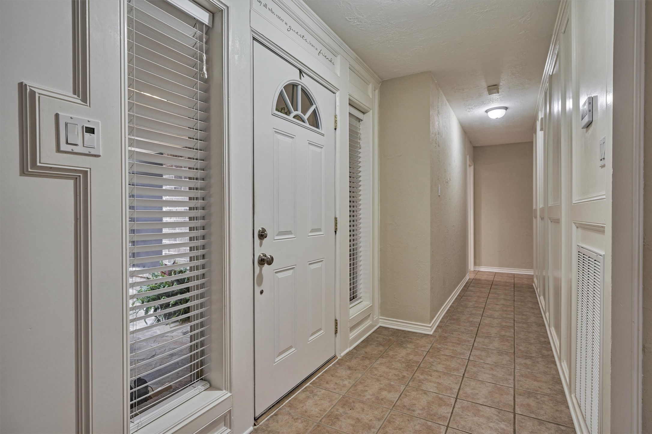 42 Devonshire Drive Conroe, TX 77304 - Photo 17 of 28 Front hallway leads to bedrooms and baths