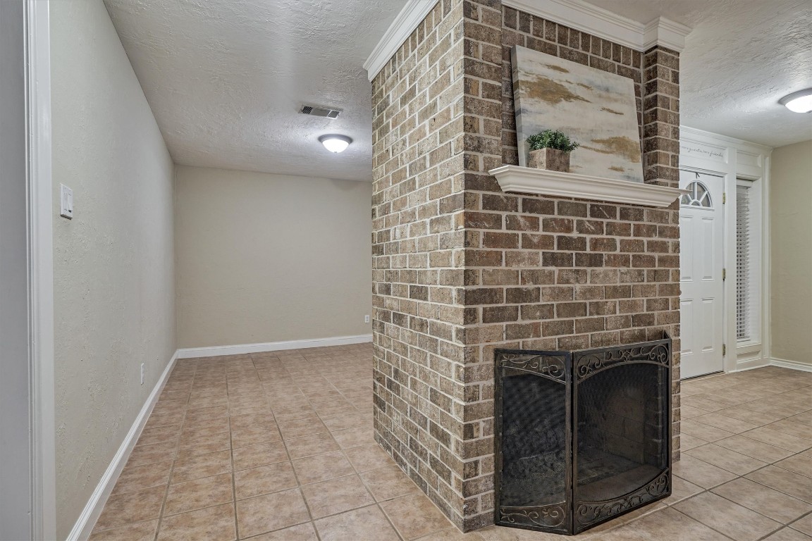 42 Devonshire Drive Conroe, TX 77304 - Photo 9 of 28 Beautiful brick accented fireplace with gas logs