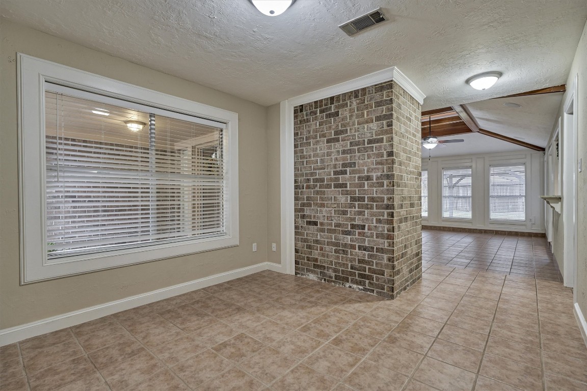 42 Devonshire Drive Conroe, TX 77304 - Photo 10 of 28 Dining room is cozy, tucked in behind fireplace and off of kitchen