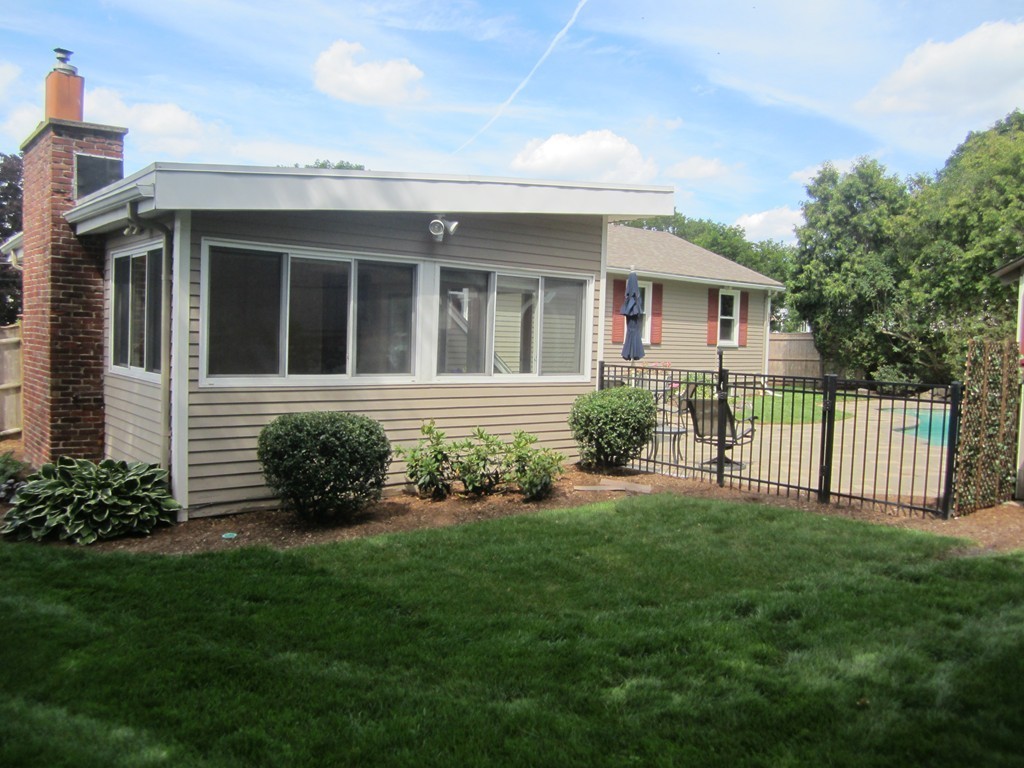 140 Brewster Road Waltham, MA 02451 - Photo 5 of 5 a front view of a house with a garden