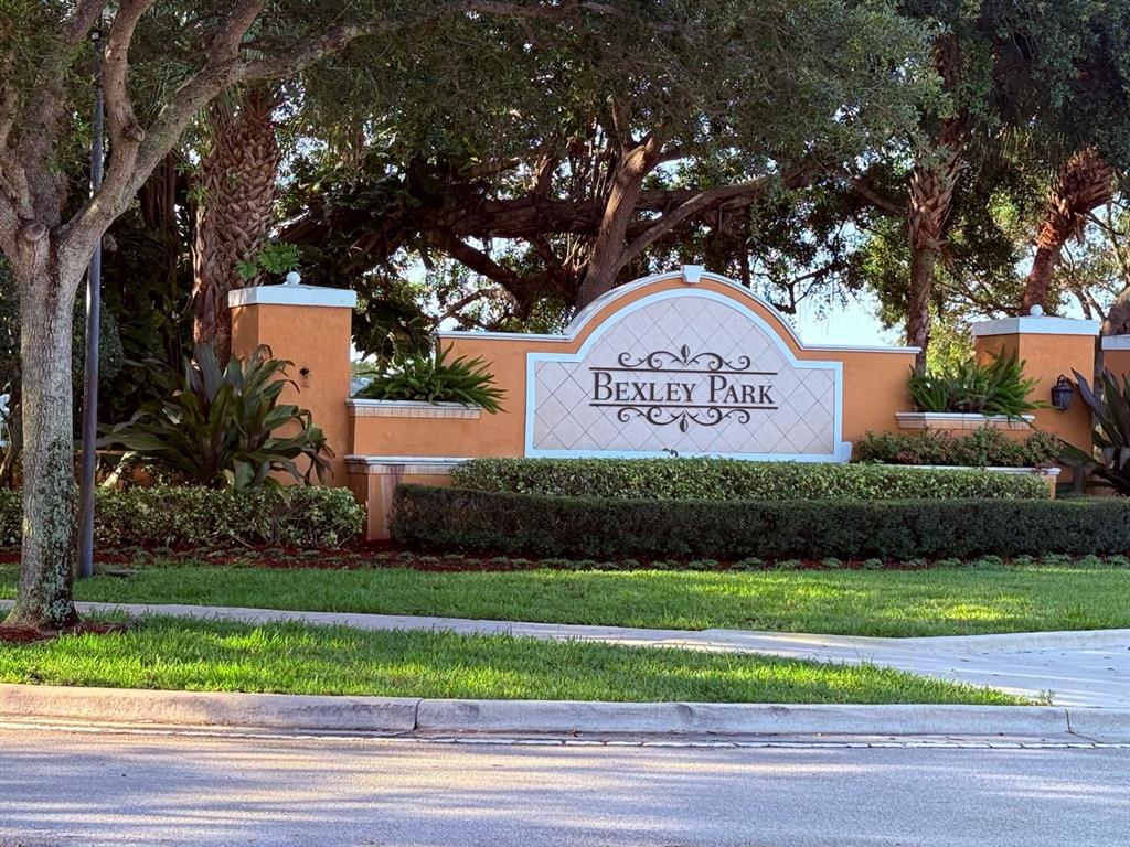4573 Danson Way Delray Beach, FL 33445 - Photo 24 of 31 a sign on the side of a road