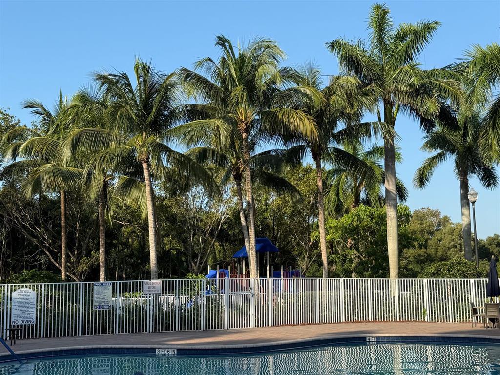 4573 Danson Way Delray Beach, FL 33445 - Photo 26 of 31 a view of a yard with a fountain
