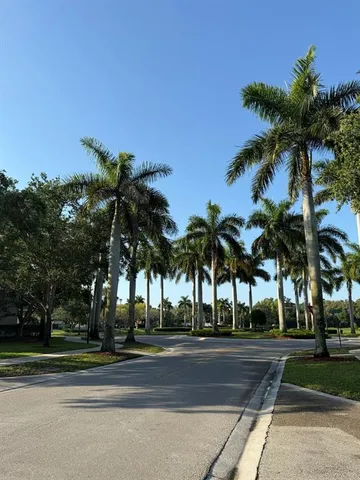 a view of yard with swimming pool and green space