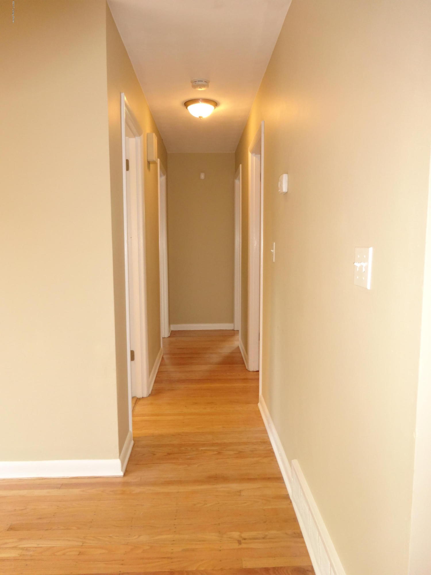 4102 Retreat Road Louisville, KY 40219 - Photo 18 of 51 HALLWAY WITH HARDWOOD FLOORS
