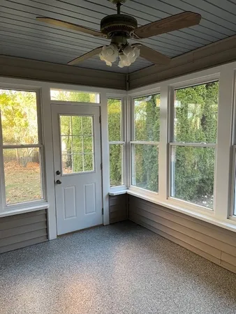 a view of an empty room with a window