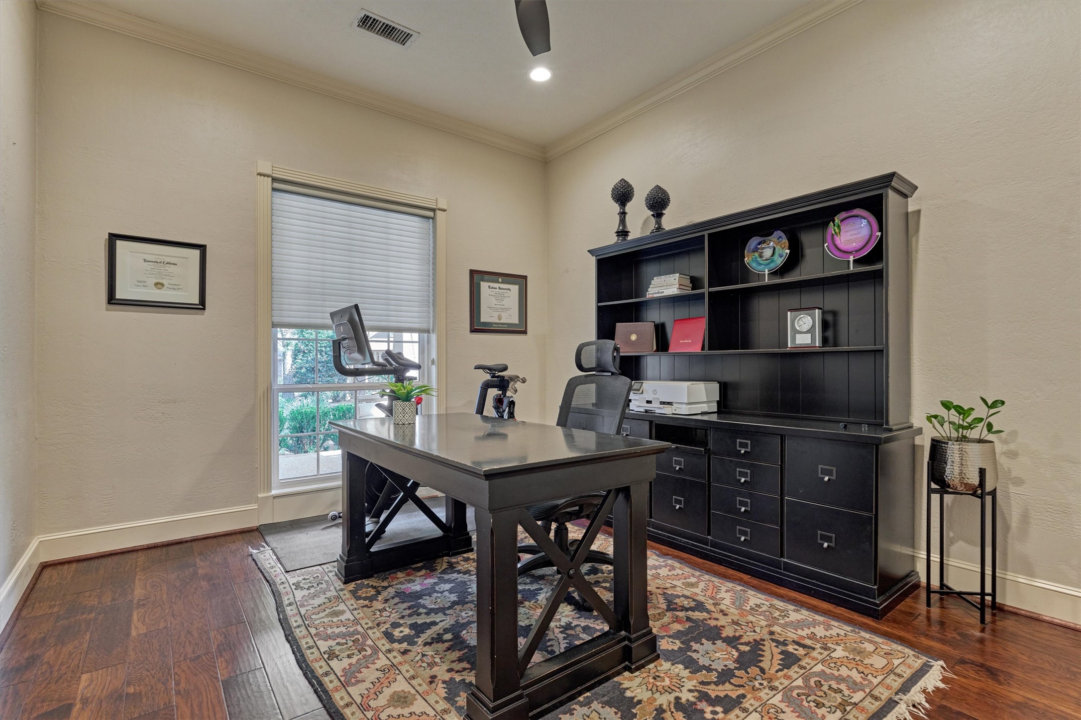 18 Treevine Court The Woodlands, TX 77381 - Photo 7 of 50 The home office is framed with double doors and a transom window that is offset from the entry for added seclusion.