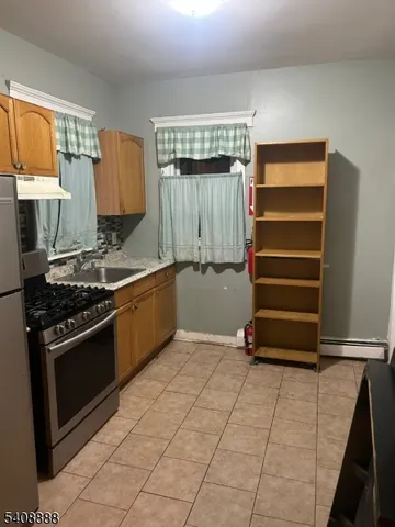 a kitchen with a stove and a cabinet