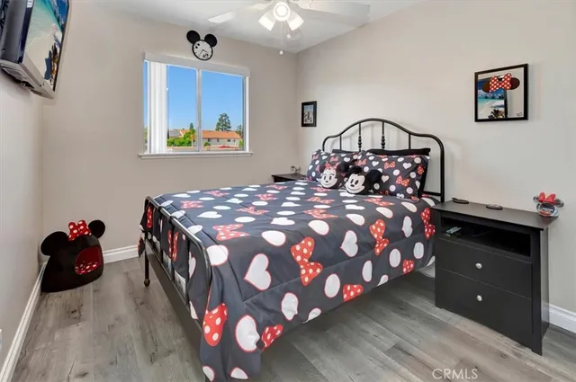 a bedroom with a bed and a dresser in it