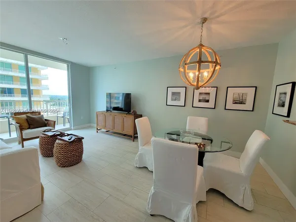 a view of a livingroom with furniture and a window