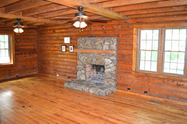 3064 Joe Mac Lipscomb Road Springfield, TN 37172 - Photo 8 of 20 The living room is a very large room with a stone wood burning fireplace. Perfect for those cold winter nights coming soon.
