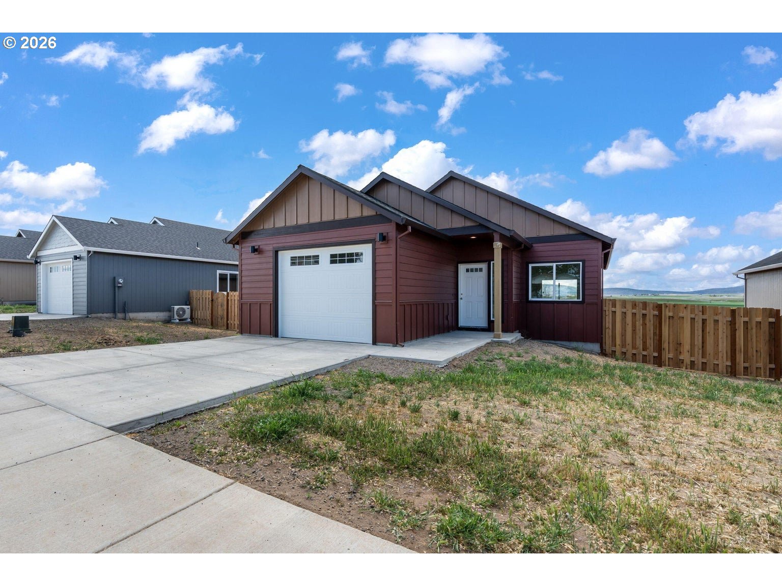 510 Southwest 6th Street Madras, OR 97741 - Photo 2 of 22 a view of a house with a yard and potted plants