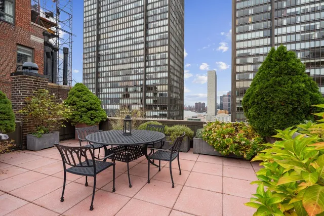 a view of a chairs and table in a patio