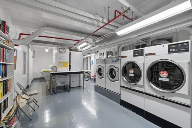 a view of a storage & utility room with washer and dryer