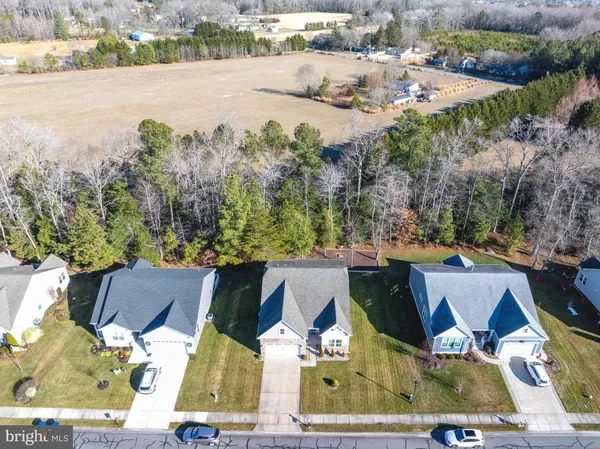 an aerial view of houses with yard