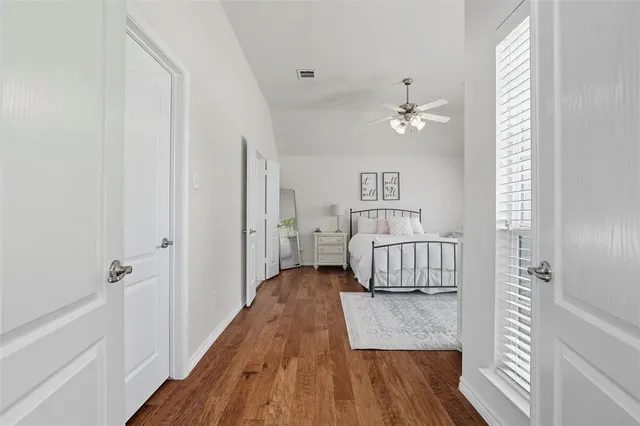 a room with a bed and a window