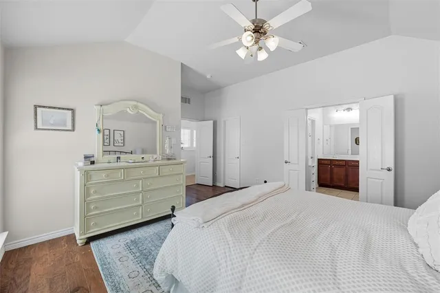 a bathroom with a tub sink shower and mirror