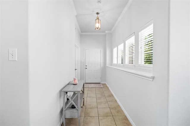 a view of hallway with windows
