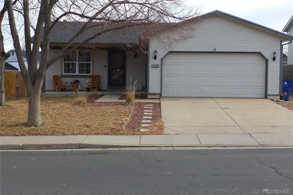 a front view of a house with garage
