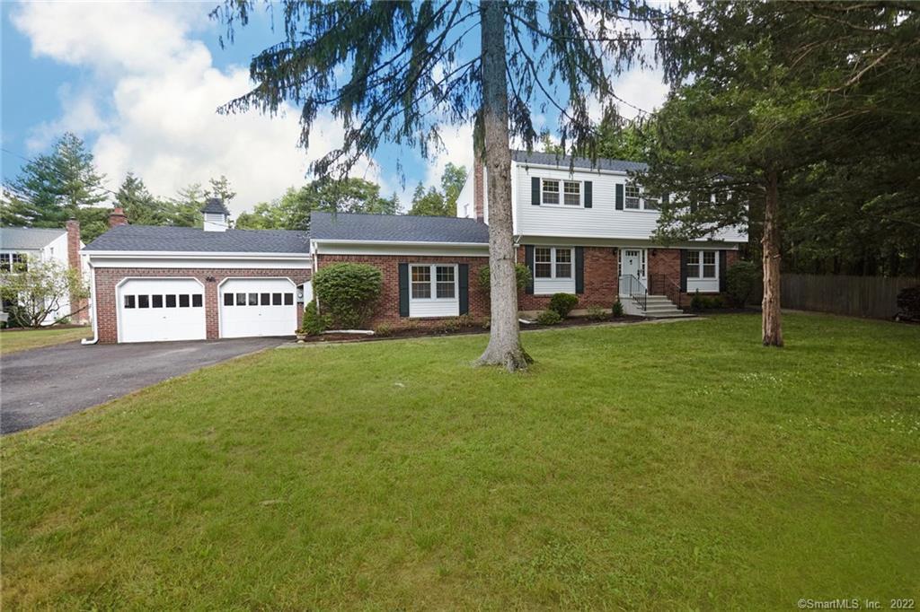 Handsome colonial is set at the end of a private road.