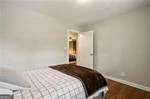 a bedroom with a bed and lamp