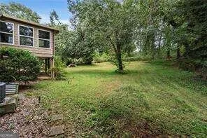 a view of backyard with green space
