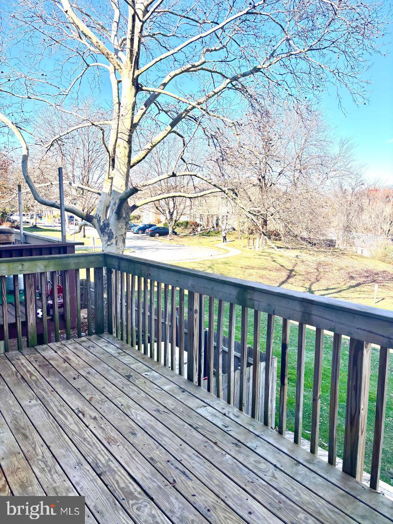 19397 Keymar Way Montgomery Village, MD 20886 - Photo 15 of 15 a balcony with wooden floor and fence