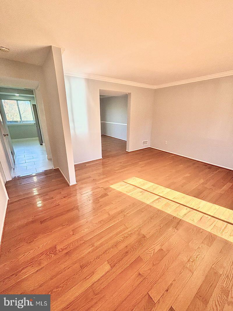 19397 Keymar Way Montgomery Village, MD 20886 - Photo 2 of 15 a view of empty room with wooden floor