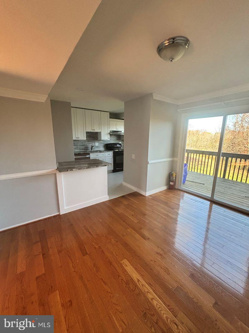 19397 Keymar Way Montgomery Village, MD 20886 - Photo 5 of 15 a room with a bed and cabinets