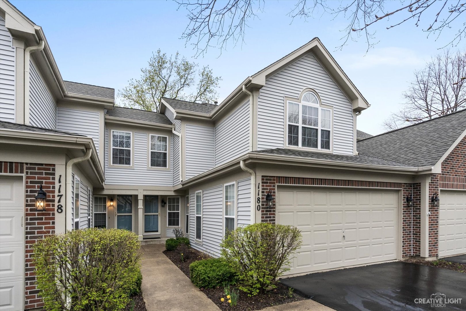 1180 Coldspring Road Elgin, IL 60120 - Photo 1 of 18 a front view of a house with a yard