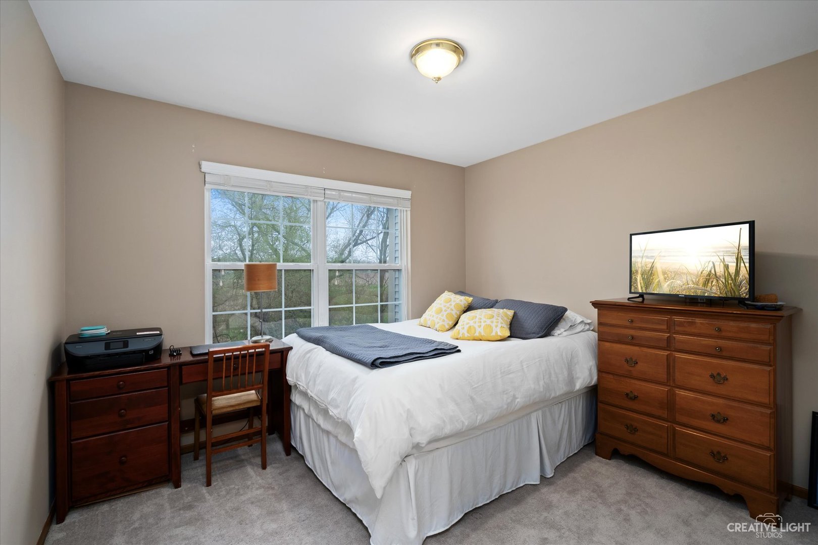 1180 Coldspring Road Elgin, IL 60120 - Photo 14 of 18 a bedroom with a bed and a flat screen tv