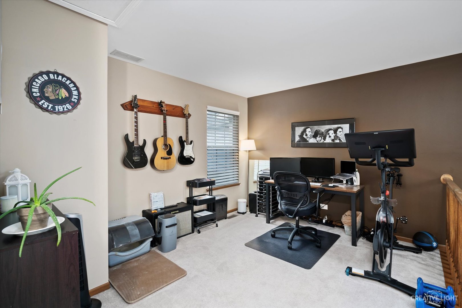 1180 Coldspring Road Elgin, IL 60120 - Photo 15 of 18 a view of a workspace with furniture and a living room